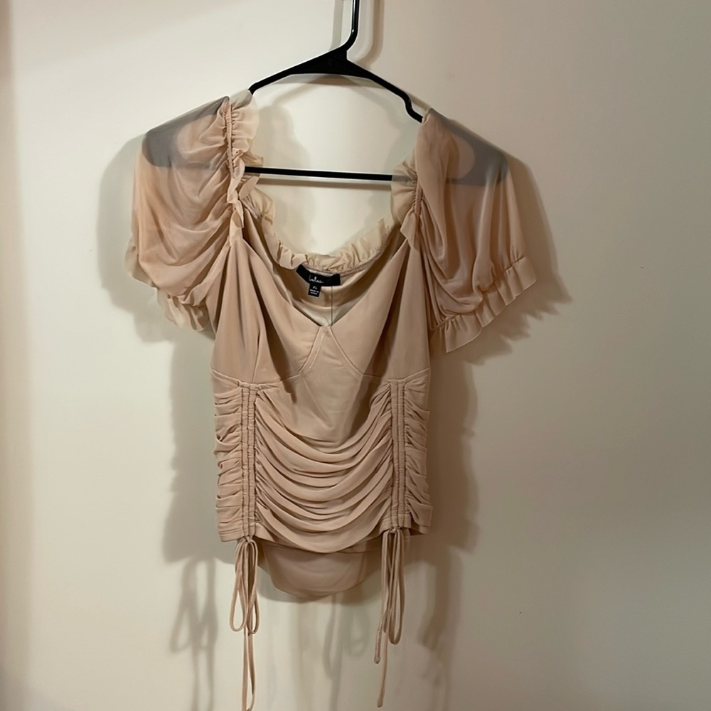 Pink colored blouse with sheer sleeves